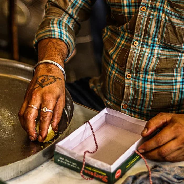 Sweets being packed by hand into a box