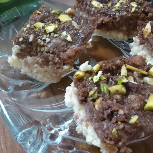Chocolate barfi: a chocolate layer on a milk base, topped with pistachio