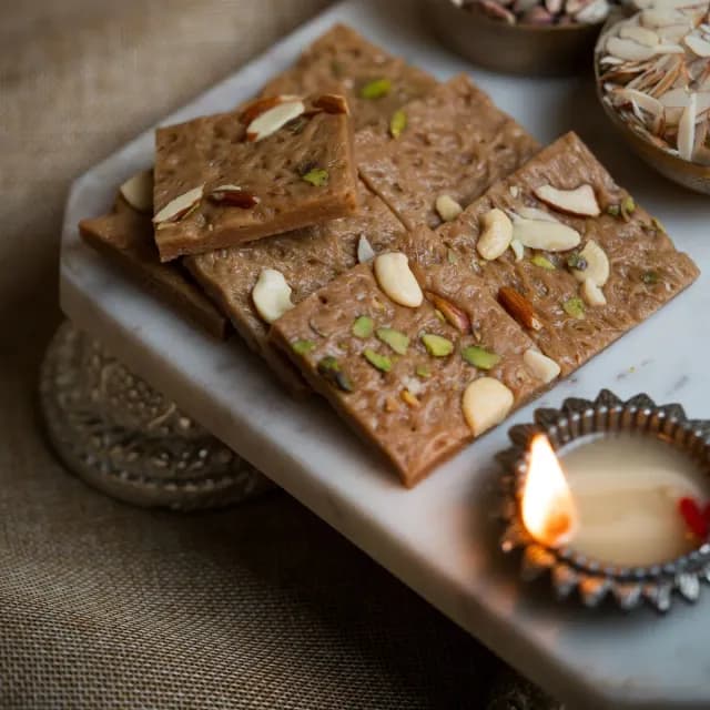 Brown mawa barfi squares studded with nuts