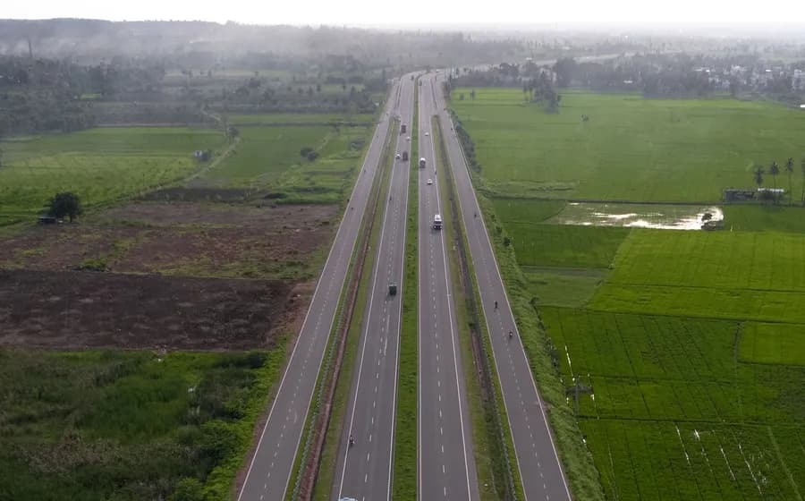 A divided highway running through green fields